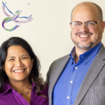 Gail & Cory Nott (Dragon logo, Gail in a purple collared shirt, Cory in a blue colored shirt and grey checkered sport coat)